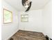 This bedroom features laminate flooring, neutral paint, and a modern ceiling fan at 2724 N Dearborn St, Indianapolis, IN 46218