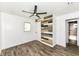This bedroom features laminate flooring, two windows, and an accent wall at 2724 N Dearborn St, Indianapolis, IN 46218
