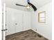 This bedroom features laminate flooring, neutral paint, and a modern ceiling fan at 2724 N Dearborn St, Indianapolis, IN 46218