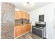 This kitchen has wooden cabinetry and stainless steel appliances at 2724 N Dearborn St, Indianapolis, IN 46218