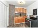 Updated kitchen with hardwood floors, modern lighting, and updated cabinets at 2724 N Dearborn St, Indianapolis, IN 46218