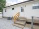 The back entrance has concrete steps and handrails and an air conditioning unit at 2909 S Randolph St, Indianapolis, IN 46203