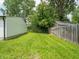 Green grassy backyard with view of the detached garage and privacy fence at 2909 S Randolph St, Indianapolis, IN 46203