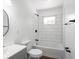Updated bathroom with new fixtures features a shower and tub combo with modern tiling at 2909 S Randolph St, Indianapolis, IN 46203