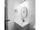 Updated bathroom featuring a vanity and mirror is freshly painted and bright at 2909 S Randolph St, Indianapolis, IN 46203