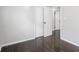 This bedroom features neutral walls, wood floors and bright white doors at 2909 S Randolph St, Indianapolis, IN 46203