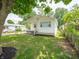 Cozy single-story home with nice landscaping, a fenced yard and freshly painted exterior at 2909 S Randolph St, Indianapolis, IN 46203