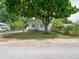 Lovely single-story home with mature shade tree, fenced yard, and well-kept lawn at 2909 S Randolph St, Indianapolis, IN 46203