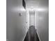 A well-lit hallway with fresh paint and dark floors connects the home's living spaces at 2909 S Randolph St, Indianapolis, IN 46203