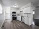 Updated kitchen with stainless steel appliances, white cabinets, granite countertops, and subway tile backsplash at 2909 S Randolph St, Indianapolis, IN 46203