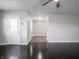 Inviting living room features hardwood floors, neutral paint, and a front door with glass at 2909 S Randolph St, Indianapolis, IN 46203