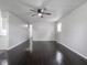 Spacious living room featuring hardwood floors, ceiling fan, and natural light at 2909 S Randolph St, Indianapolis, IN 46203