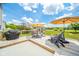 Relaxing back deck featuring patio furniture, grill, and a partially covered area, perfect for outdoor entertaining at 296 Myers Lake Dr, Noblesville, IN 46062