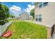 Well-maintained backyard with a white picket fence and lush green lawn, creating a private and serene outdoor space at 296 Myers Lake Dr, Noblesville, IN 46062