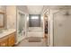 En suite bathroom with walk-in closet, bathtub, and a large vanity with sink at 296 Myers Lake Dr, Noblesville, IN 46062