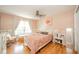 Cozy bedroom with a bed and lots of natural light from the large window and light-colored walls at 296 Myers Lake Dr, Noblesville, IN 46062