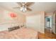 Bedroom with a closet, ceiling fan, light-colored walls, and a dresser with a television at 296 Myers Lake Dr, Noblesville, IN 46062