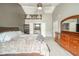 Bedroom with ceiling fan, dresser, walk-in closet, and an en suite bathroom with bathtub at 296 Myers Lake Dr, Noblesville, IN 46062
