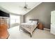 Comfortable bedroom featuring a ceiling fan, neutral color palette, and lots of natural light at 296 Myers Lake Dr, Noblesville, IN 46062