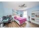 Blue bedroom with a ceiling fan, desk, and a large window at 296 Myers Lake Dr, Noblesville, IN 46062