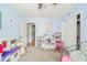 Bright bedroom featuring carpet, closet, shelving unit, and playful wall decals at 296 Myers Lake Dr, Noblesville, IN 46062
