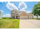 Beautiful two-story brick home with a spacious three-car garage and manicured front lawn at 296 Myers Lake Dr, Noblesville, IN 46062