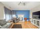 Inviting living room featuring hardwood floors, a fireplace, and ample seating, perfect for relaxation and gatherings at 296 Myers Lake Dr, Noblesville, IN 46062