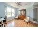 Bright home office featuring hardwood floors, large windows, and a classic hutch at 296 Myers Lake Dr, Noblesville, IN 46062