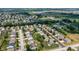 Expansive aerial view of a well-maintained suburban neighborhood with tree-lined streets and spacious green lawns at 3058 Mcintosh Dr, Bargersville, IN 46106