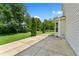 A view of the home's concrete patio and landscaped backyard at 3058 Mcintosh Dr, Bargersville, IN 46106