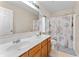 Bathroom featuring double sinks, a seashell-themed shower curtain, a toilet, and a large mirror at 3058 Mcintosh Dr, Bargersville, IN 46106