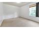 Bright bedroom features neutral carpeting, a window bringing in natural light, and freshly painted walls at 3058 Mcintosh Dr, Bargersville, IN 46106