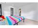 Bright bedroom with neutral walls and carpet, features a closet and open doorway at 3058 Mcintosh Dr, Bargersville, IN 46106