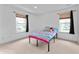 Bedroom features two sunny windows, neutral walls, and carpet flooring at 3058 Mcintosh Dr, Bargersville, IN 46106