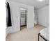 Clean bedroom featuring a closet with shelving, neutral carpet, and white walls at 3058 Mcintosh Dr, Bargersville, IN 46106