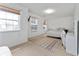 Bright bedroom featuring multiple windows, a bed with decorative pillows, and neutral walls with carpet at 3058 Mcintosh Dr, Bargersville, IN 46106