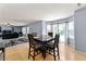 Well-lit dining area with wood table and chairs, adjacent to sliding glass doors at 3058 Mcintosh Dr, Bargersville, IN 46106