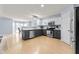Open kitchen features stainless steel appliances, gray cabinets, and a dining area at 3058 Mcintosh Dr, Bargersville, IN 46106