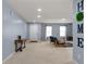 Bright living room featuring a futon and a view of the white front door at 3058 Mcintosh Dr, Bargersville, IN 46106