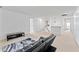Large living room with dark grey leather sofa, neutral carpet, and lots of natural light at 3058 Mcintosh Dr, Bargersville, IN 46106