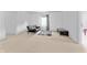 Spacious living room with a comfortable black sofa, a gray geometric rug and neutral carpeting at 3058 Mcintosh Dr, Bargersville, IN 46106