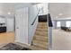Carpeted staircase with light blue walls and modern art leading to the upper level at 3058 Mcintosh Dr, Bargersville, IN 46106