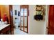 Comfortable bathroom featuring a toilet, wooden cabinet, and stylish decorative elements at 3422 Sycamore Dr, Columbus, IN 47203