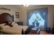 Inviting bedroom with a queen-sized bed, bedside tables, and natural light streaming through the window at 3422 Sycamore Dr, Columbus, IN 47203