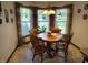 Dining area with a wooden table and chairs with view to the outside at 3422 Sycamore Dr, Columbus, IN 47203