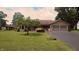 Charming single-story ranch home with a well-manicured lawn and attached two-car garage at 3422 Sycamore Dr, Columbus, IN 47203