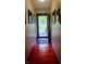 Hallway with hardwood floors leads to the front door, providing an inviting entrance at 3422 Sycamore Dr, Columbus, IN 47203