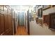 Long hallway with hardwood floors and a gallery of framed pictures on the wall at 3422 Sycamore Dr, Columbus, IN 47203