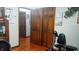 Spacious hallway featuring hardwood floors, doors and a fitness bike at 3422 Sycamore Dr, Columbus, IN 47203