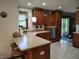 Bright eat-in kitchen with a breakfast bar, stainless steel dishwasher, and custom oak cabinetry at 3422 Sycamore Dr, Columbus, IN 47203